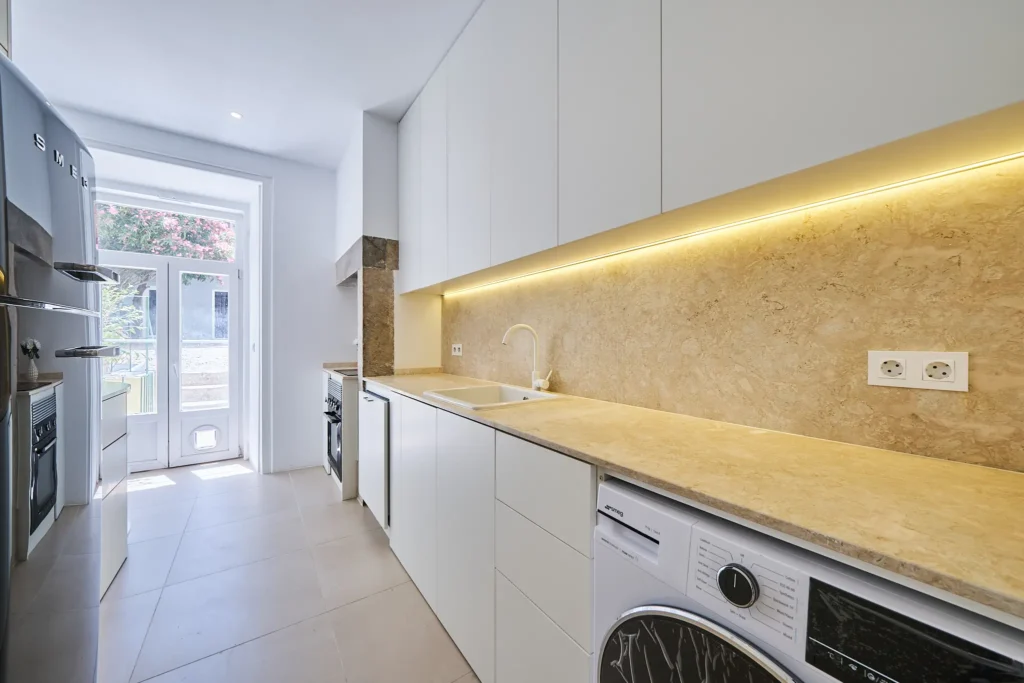 Fully equipped kitchen with premium Smeg in Lisbon apartment currently for sale.